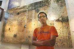 Dwarfed: Hamidi looking diminutive in front of his large-scale piece entitled You Hold My Breath @ Anjur.